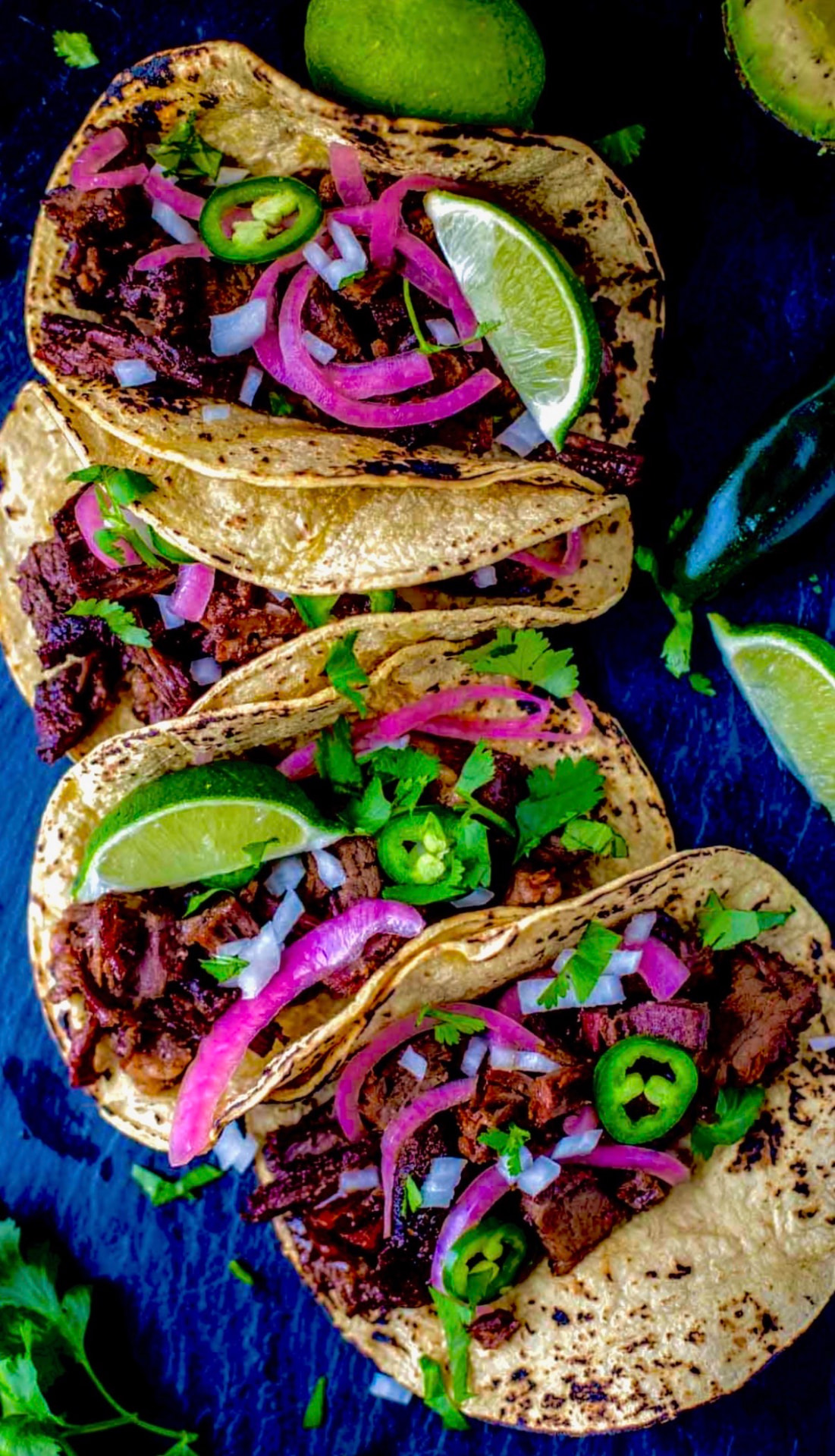 Brisket tacos with pickled red onions and cabbage